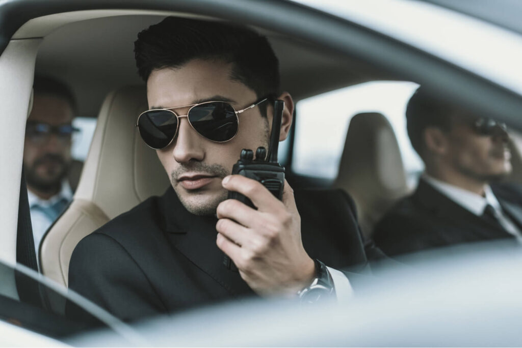 bodyguard-in-sunglasses-talking-by-portable-radio-2021-09-29-14-57-07-utc.jpg