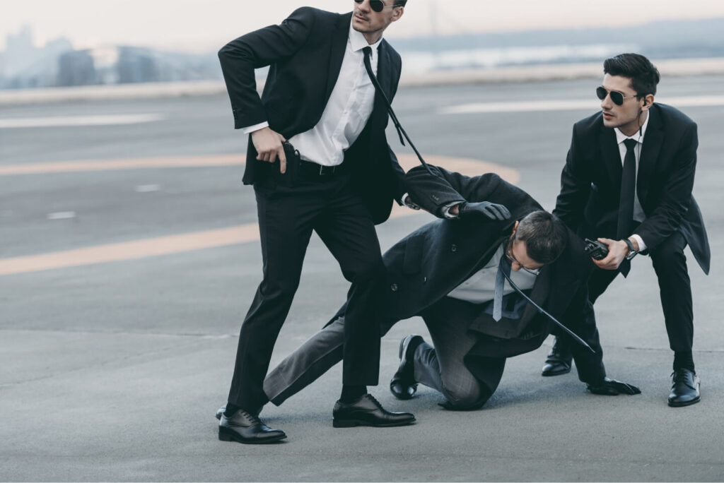 cropped-image-of-two-bodyguards-protecting-falling-2022-02-07-10-36-24-utc.jpg