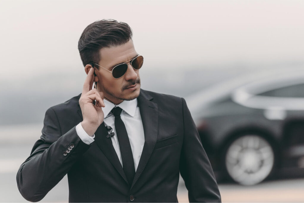 handsome-bodyguard-listening-message-with-security-2021-08-29-18-18-52-utc.jpg