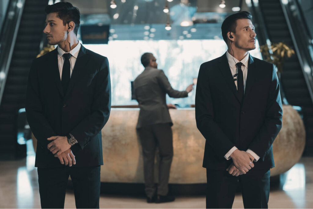 two-bodyguards-waiting-for-businessman-standing-at-2021-08-29-18-19-01-utc.jpg